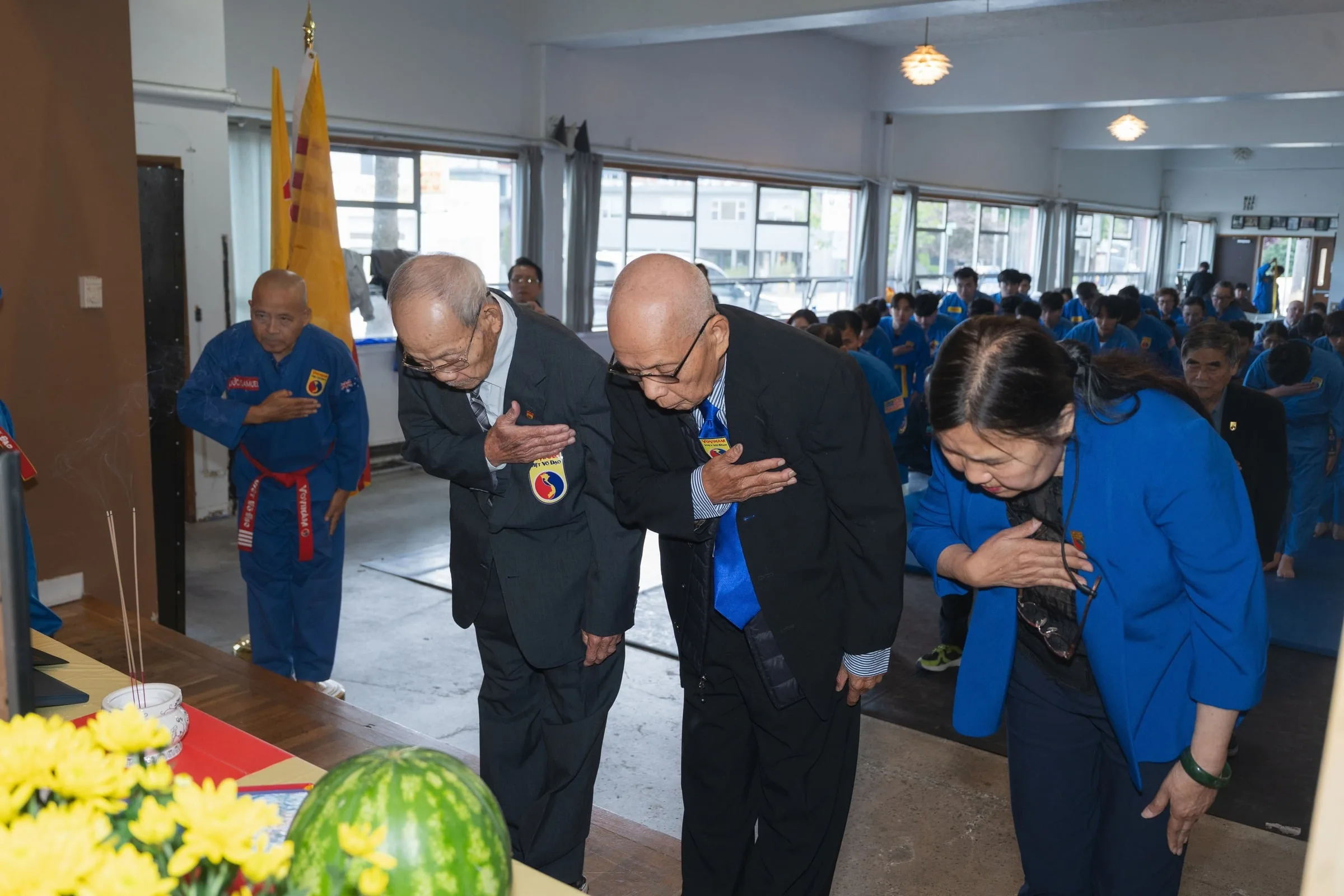 Masters bowing at a ceremony