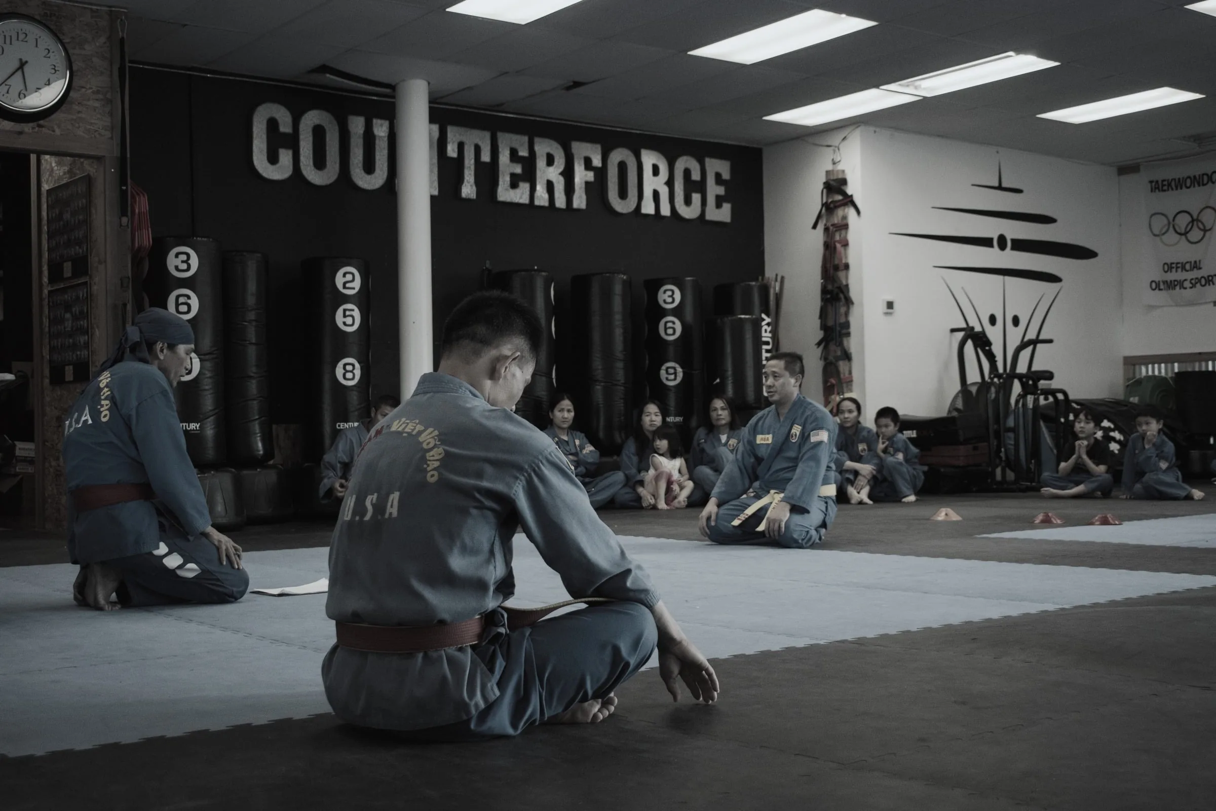 Students seated on the mat